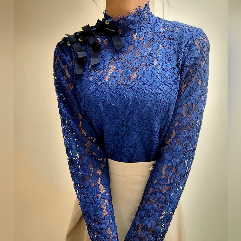 Blue J. Crew Blouse with black bows, size 0.